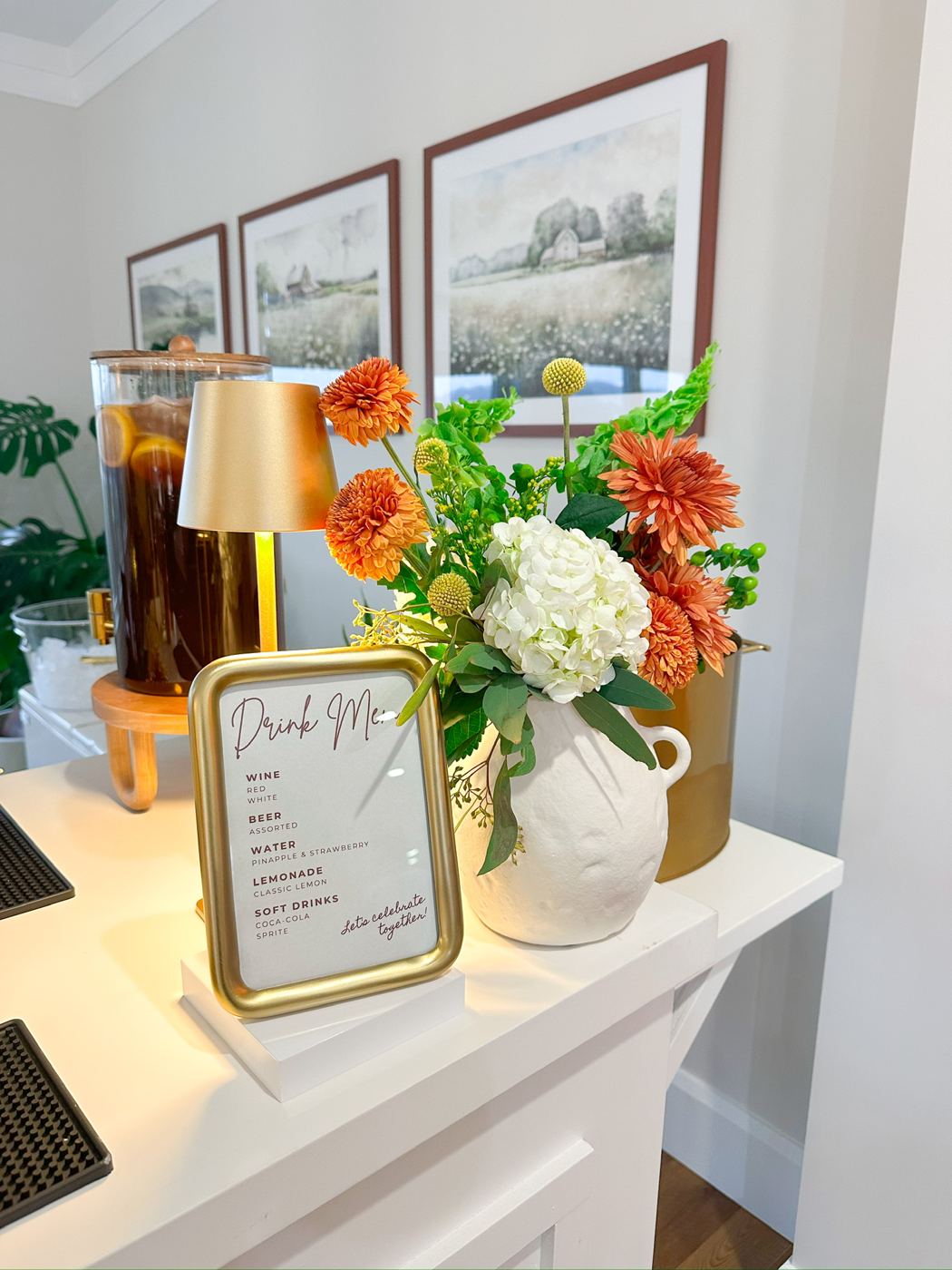 Beverage cart styled with florals and a custom menu